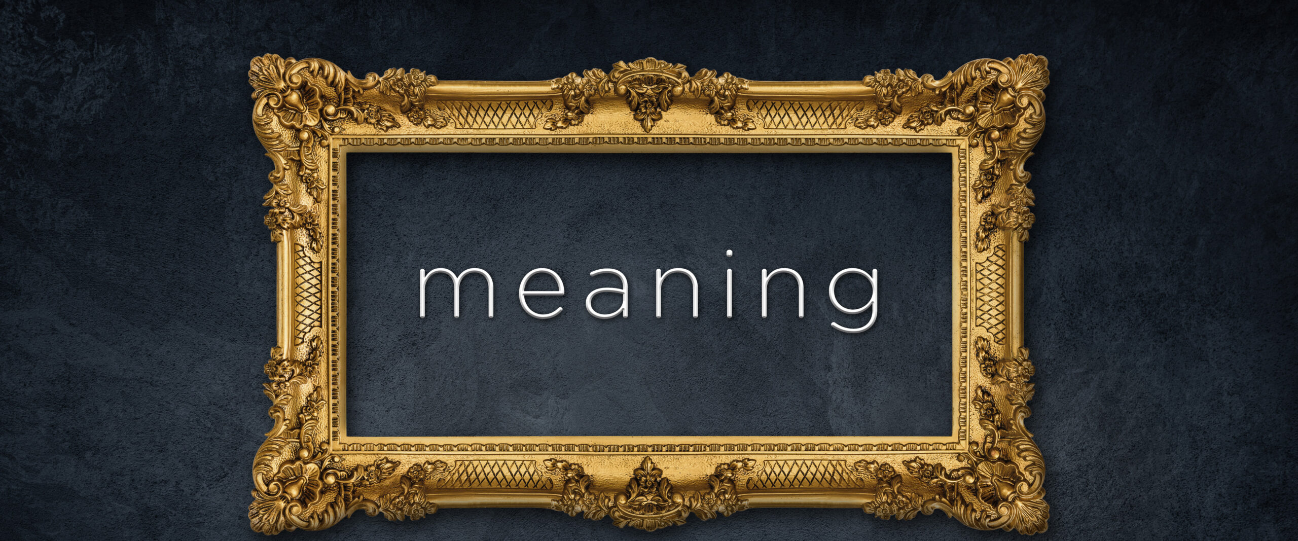 Banner of an ornate picture frame with the word "meaning" inside of it